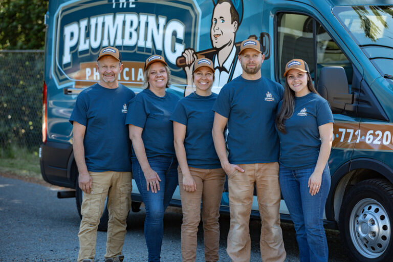 Team standing in front of a branded van.